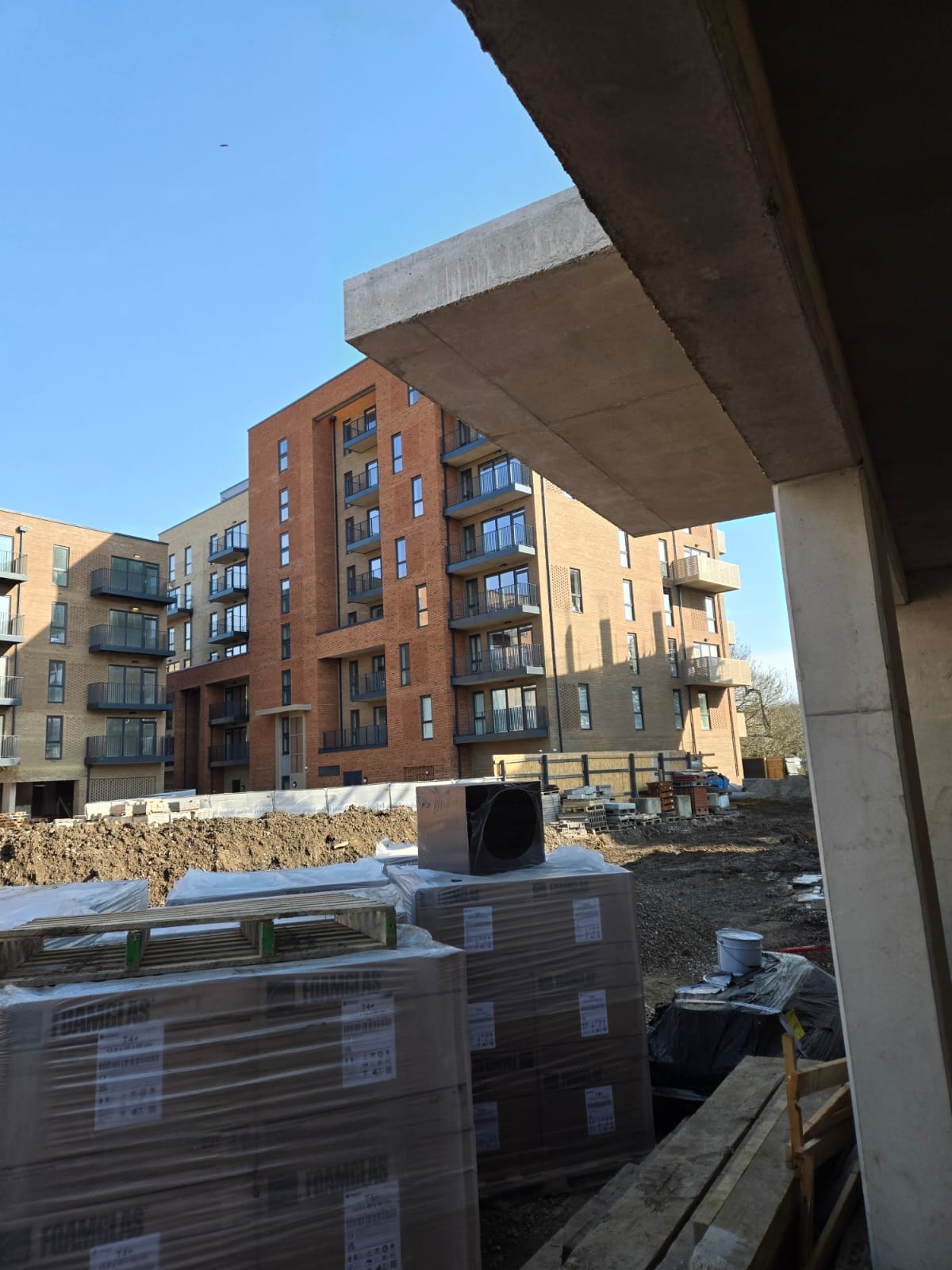 Mixed-use style building frontage and access area prepared for operational support works.